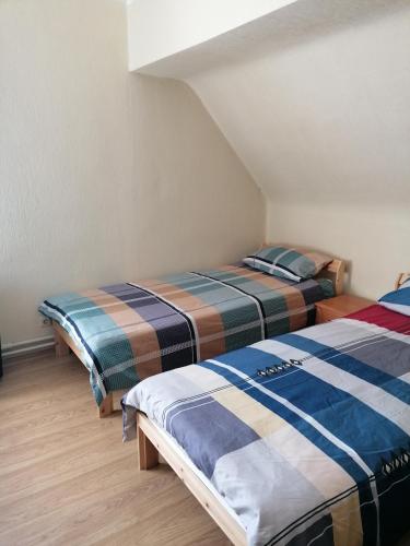 two beds sitting next to each other in a room at Sea and Sun in Jūrmala