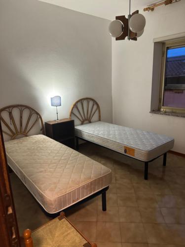 En eller flere senge i et værelse på Casarosa