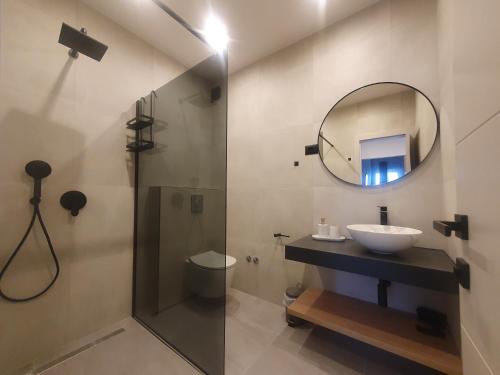 a bathroom with a sink and a mirror and a shower at SmartStay Johnny in Podstrana
