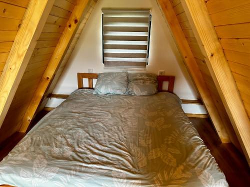 a bed in a small room in a attic at Microcastl in Vlasic