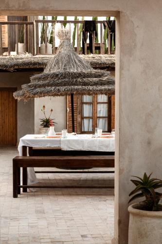 Una cama o camas en una habitación de The O Experience - Tayourt Lodge