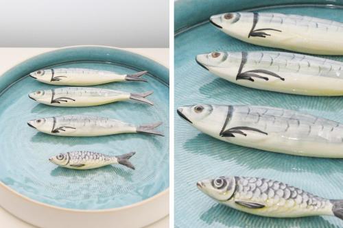 two pictures of fish on a blue plate at Alecrim ao Chiado in Lisbon