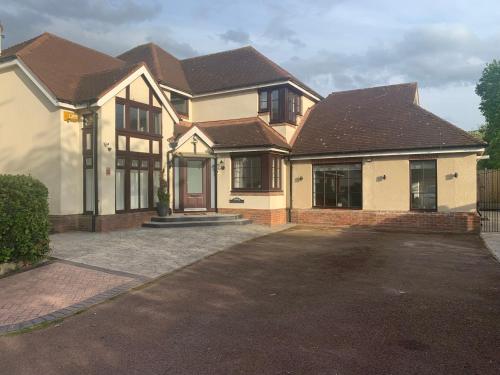 a house with a driveway in front of it at Cunningham in Nottingham