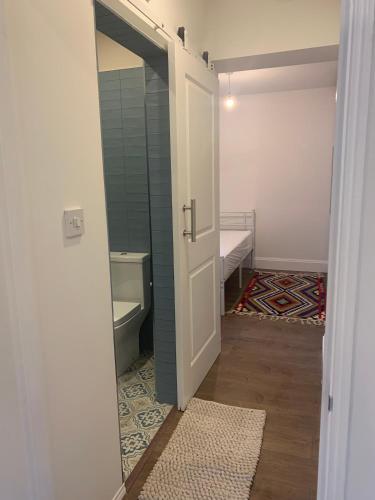 an open door to a bathroom with a toilet at Cunningham in Nottingham
