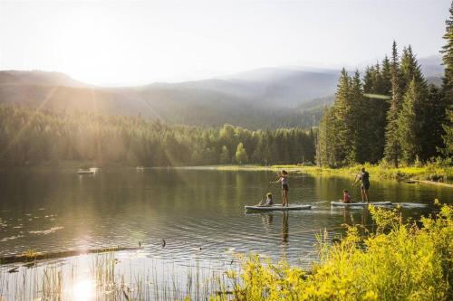 a group of people on a boat on a lake at Bear Lodge, Whistler Village - Spectacular Location on Village Stroll, Designer Remodel in Whistler
