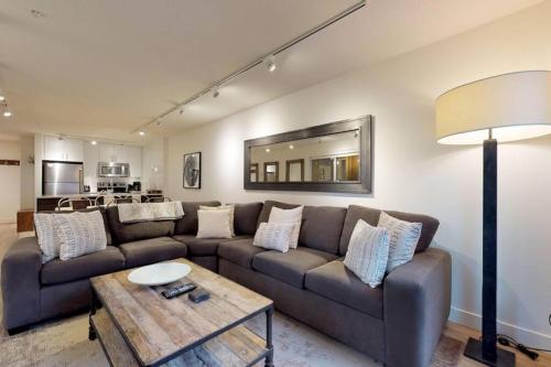 a living room with a couch and a table at Bear Lodge, Whistler Village - Spectacular Location on Village Stroll, Designer Remodel in Whistler
