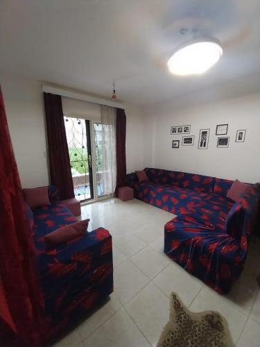 a living room with a couch and chairs in it at Tavira شاليه in Ras Sedr