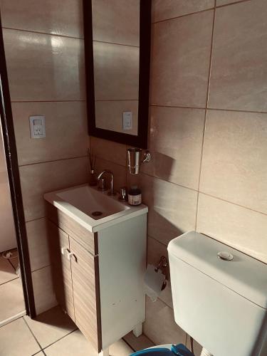 a bathroom with a sink and a toilet at Lo de Lito in Sierra de la Ventana