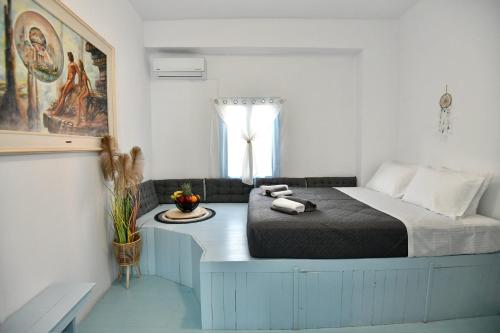 a bedroom with a large bed and a window at Katia’s Home in Rhodes Town