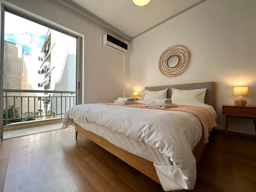 Ένα ή περισσότερα κρεβάτια σε δωμάτιο στο A7 Luxury Boutique Apartment in Thiseio