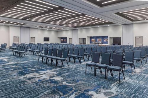 a room with rows of chairs in a hall at Hampton Inn & Suites Indianapolis West Speedway in Indianapolis