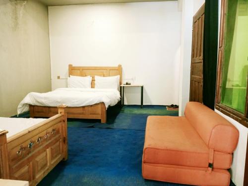 Ένα ή περισσότερα κρεβάτια σε δωμάτιο στο BONO MOTELS