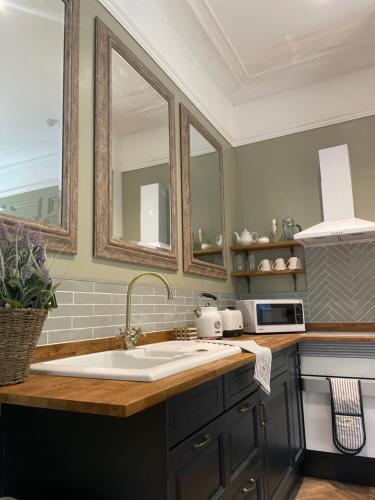 a kitchen with a sink and a counter top at Penarwyn House in Par