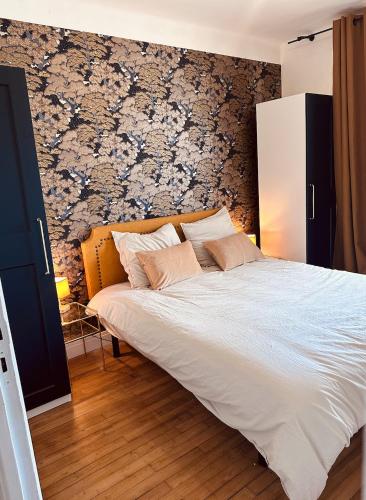 Giường trong phòng chung tại L Appartement - Siam vue Capucins