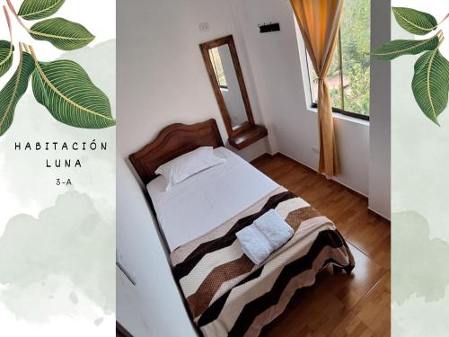 1 dormitorio con cama y ventana en Killari-Hospedaje Puro Jita, en Lunahuaná