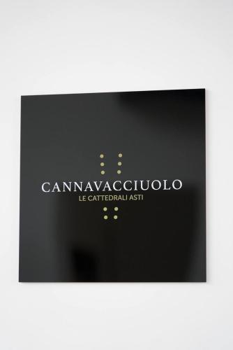 a logo for a car manufacturing company on a black background at Le Cattedrali Relais by Laqua Collection in Asti