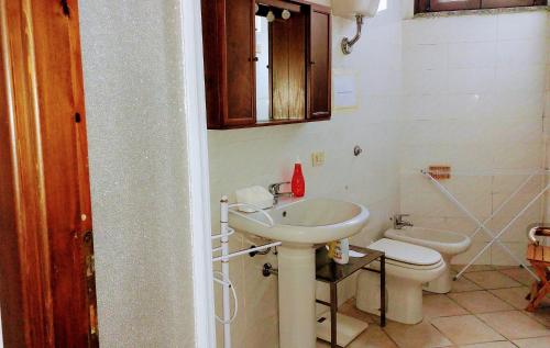 a bathroom with a sink and a toilet at casa panoramica in Teulada