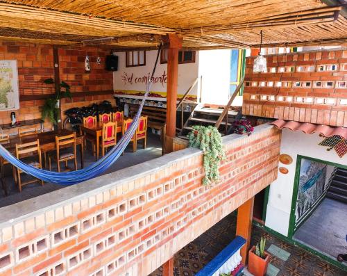 an overhead view of a restaurant with a hammock at Hostal El Caminante in El Cocuy