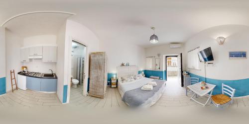 a large living room with a large bed in a room at Il Casalino Apartment in Pizzo