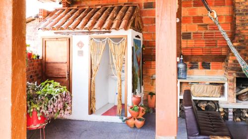 a dog house with a door in a building at Hostal El Caminante in El Cocuy