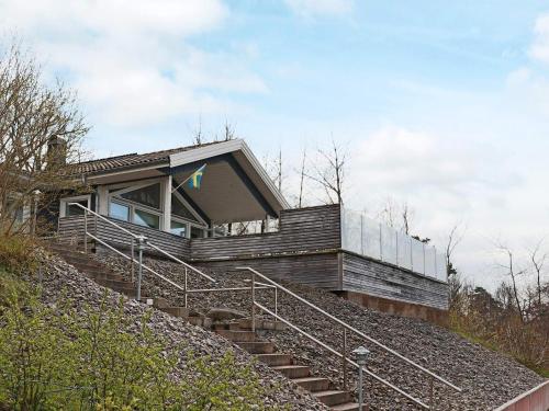 a house on the side of a hill with stairs at 5 star holiday home in STENINGE in Steninge