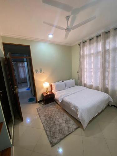 Postel nebo postele na pokoji v ubytování maasaifari Cozy 2