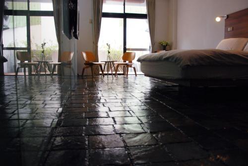 Ένα ή περισσότερα κρεβάτια σε δωμάτιο στο Howcome spots homestay