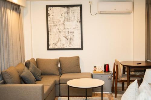 a living room with a couch and a table at Hiyala home in Male City