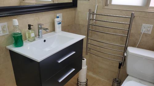 a bathroom with a sink and a toilet at Beautiful Home 4 Bd. 2 Ba. SF. in San Francisco