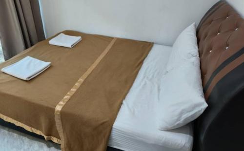 Ένα ή περισσότερα κρεβάτια σε δωμάτιο στο NaVita Lodge