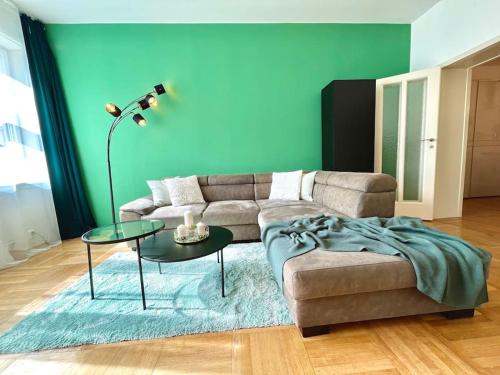a living room with a couch and a table at Luxury Apartment in Old Town in Prague