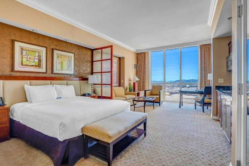 a large bedroom with a bed and a living room at 32nd Flr Penthouse MGM Signature studio No Fee in Las Vegas