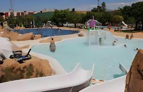 a view of a water park with people in it at House Valencia in Cuart de Poblet