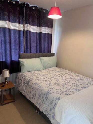 Voodi või voodid majutusasutuse Newport Pagnel Guest house toas