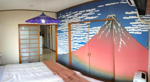 a bedroom with a mural of a mountain at 2BR 4 Beds 6 min walk to Sta. Katsushika Hokusai 17 min walk JR Sta. in Nikko