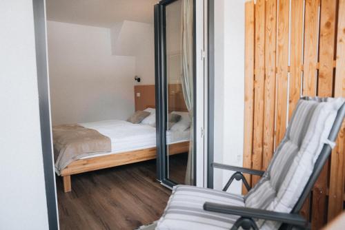 Postel nebo postele na pokoji v ubytování Podlipnik Apartments