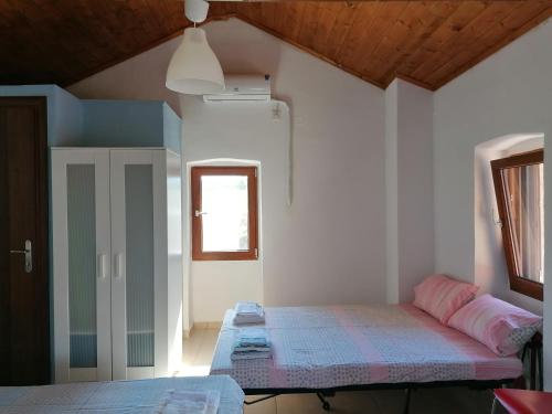Ένα ή περισσότερα κρεβάτια σε δωμάτιο στο Xemoni House