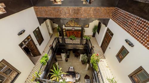 an overhead view of a staircase in a building with plants at Dar Najat in Marrakech