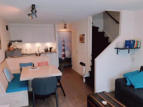 En eller flere senge i et værelse på Amelanderkaap 31 met zwembad