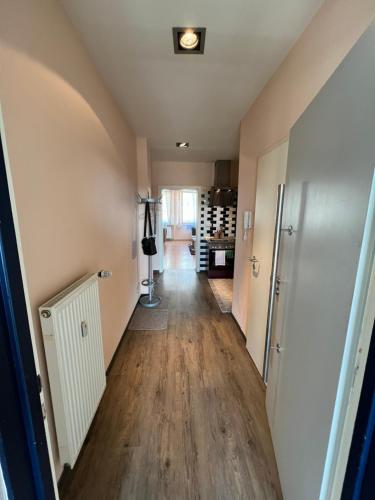 a hallway in a house with wood floors at Innenstadt Lübeck Ferienwohnung in Lübeck