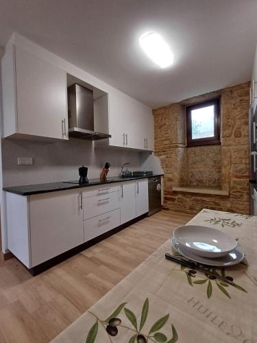 Kuchyň nebo kuchyňský kout v ubytování Casa O Sopé