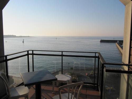 a balcony with a view of the water at Albatros in Quiberon