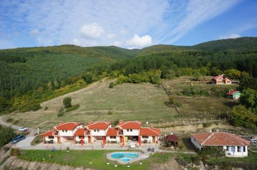 an aerial view of a house on a hill at Gledkata Complex in Skobelevo
