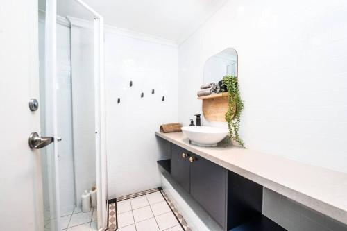 a bathroom with a sink and a mirror at CBD Sydney - KING Suite Sussex St 2 Room 1 Parking in Sydney