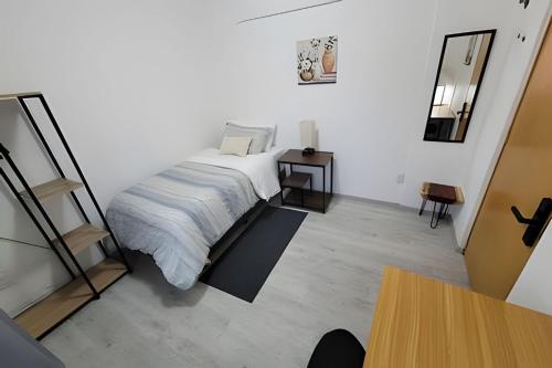 Ένα ή περισσότερα κρεβάτια σε δωμάτιο στο Casa Maribel