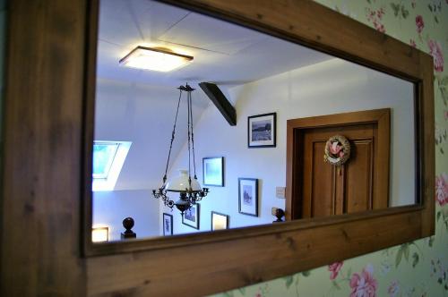 a mirror reflection of a room with a hallway at Farma Moulisových in Nezvěstice
