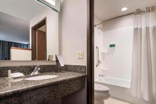 a bathroom with a sink and a toilet at Courtyard Seattle Downtown / Pioneer Square in Seattle