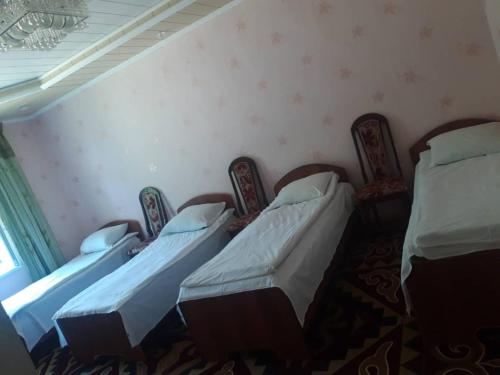 a group of beds in a room at CBT Arkit guest house in Arkit