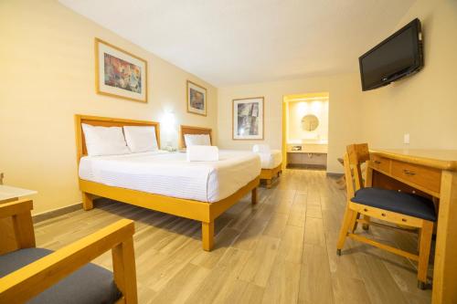 Voodi või voodid majutusasutuse Hotel Colonial Ciudad Juarez toas