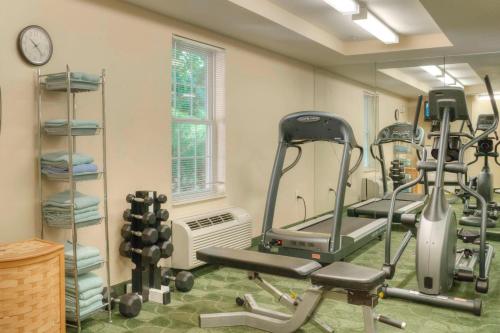 a gym with tread machines and a mirror at TownePlace Suites Raleigh Cary/Weston Parkway in Cary